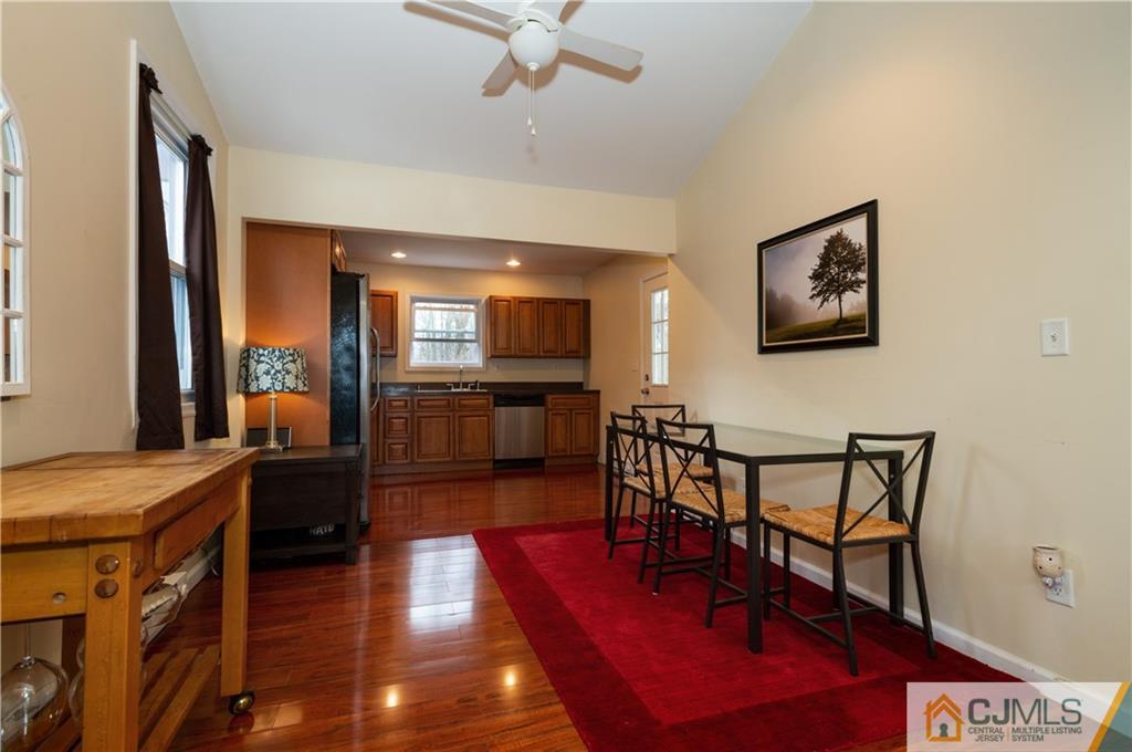 10 Soden Lane Old Bridge, NJ 08857 - Photo 10 of 20 a view of a dining room with furniture a chandelier and wooden floor