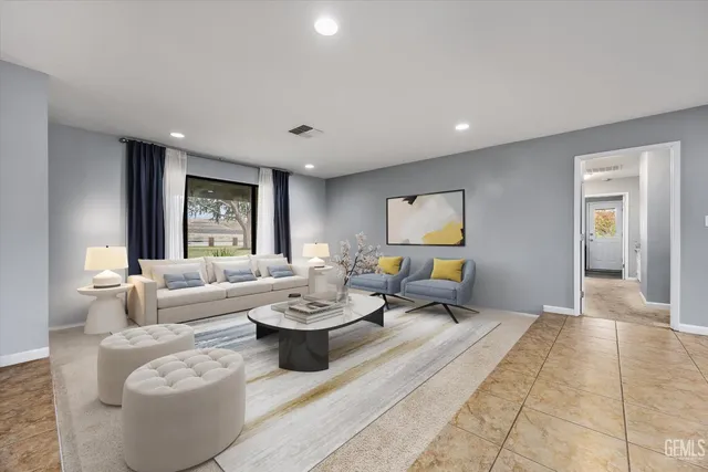 a kitchen with stainless steel appliances granite countertop a sink refrigerator and cabinets