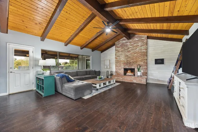 a living room with a bed furniture and window