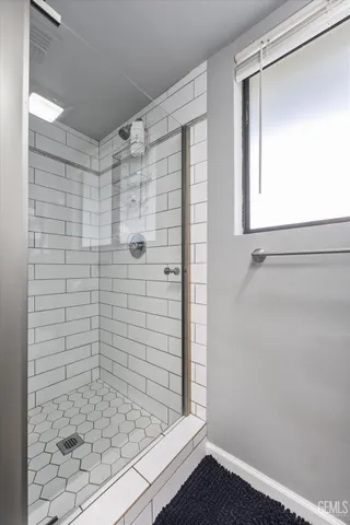 a dining room with furniture and a window