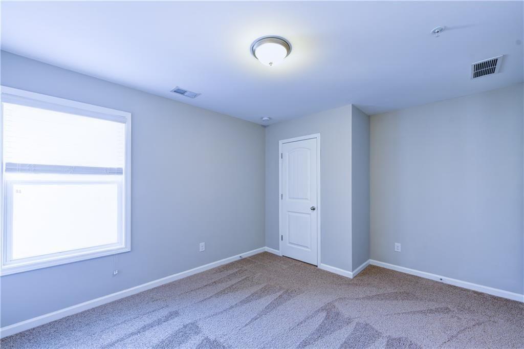 1226 Fischer Trace Cumming, GA 30041 - Photo 19 of 24 an empty room with a window