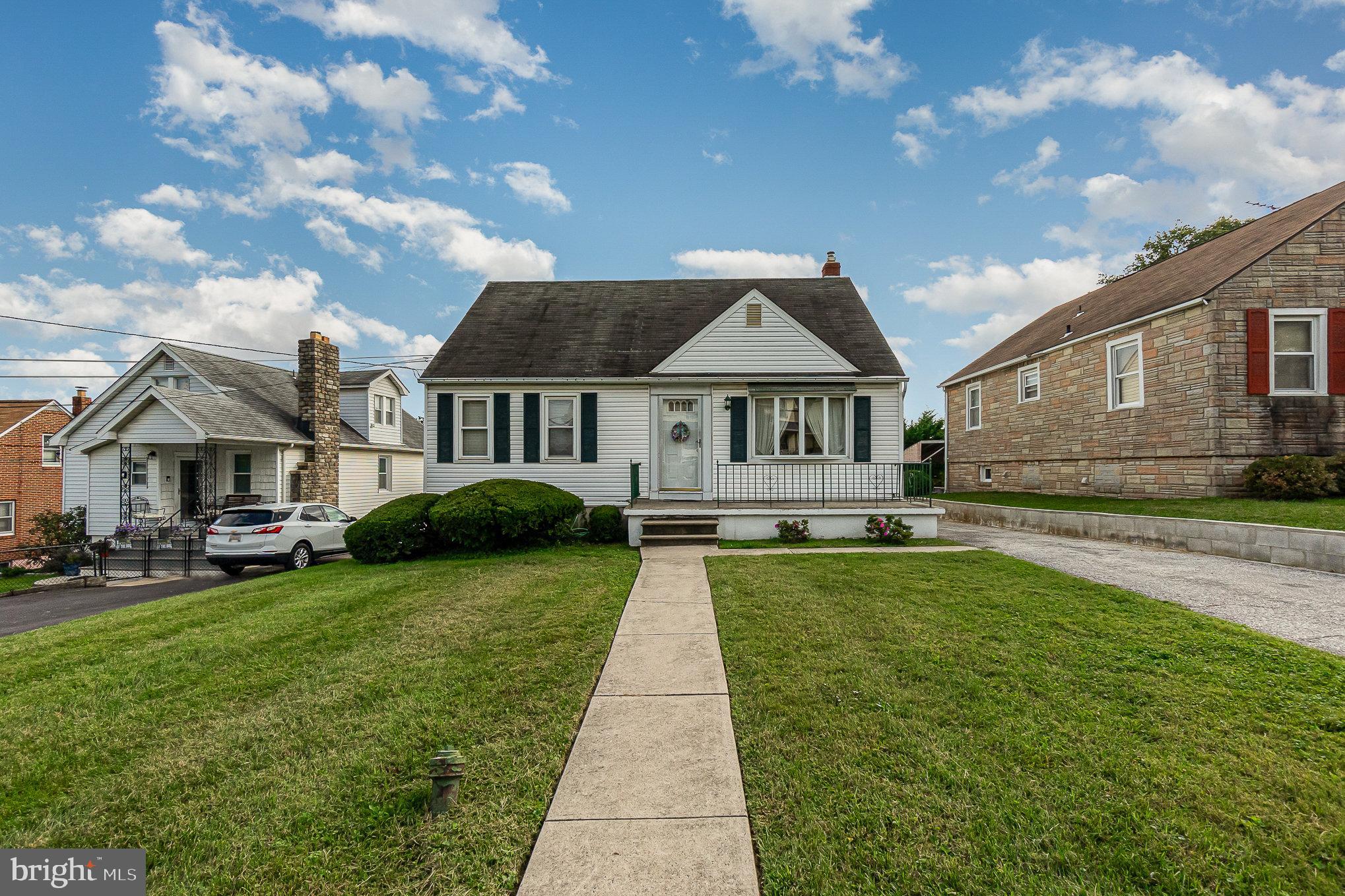 7925 35th Street Rosedale, MD 21237 - Photo 2 of 30 a front view of a house with a garden and yard