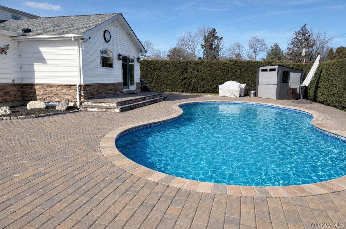 19 Radburn Drive Commack, NY 11725 - Photo 25 of 25 yard with pavers and pool