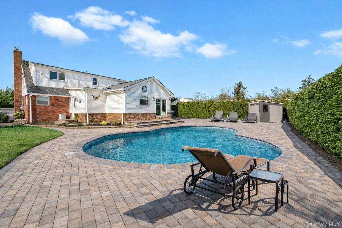 19 Radburn Drive Commack, NY 11725 - Photo 3 of 25 yard with pavers and pool