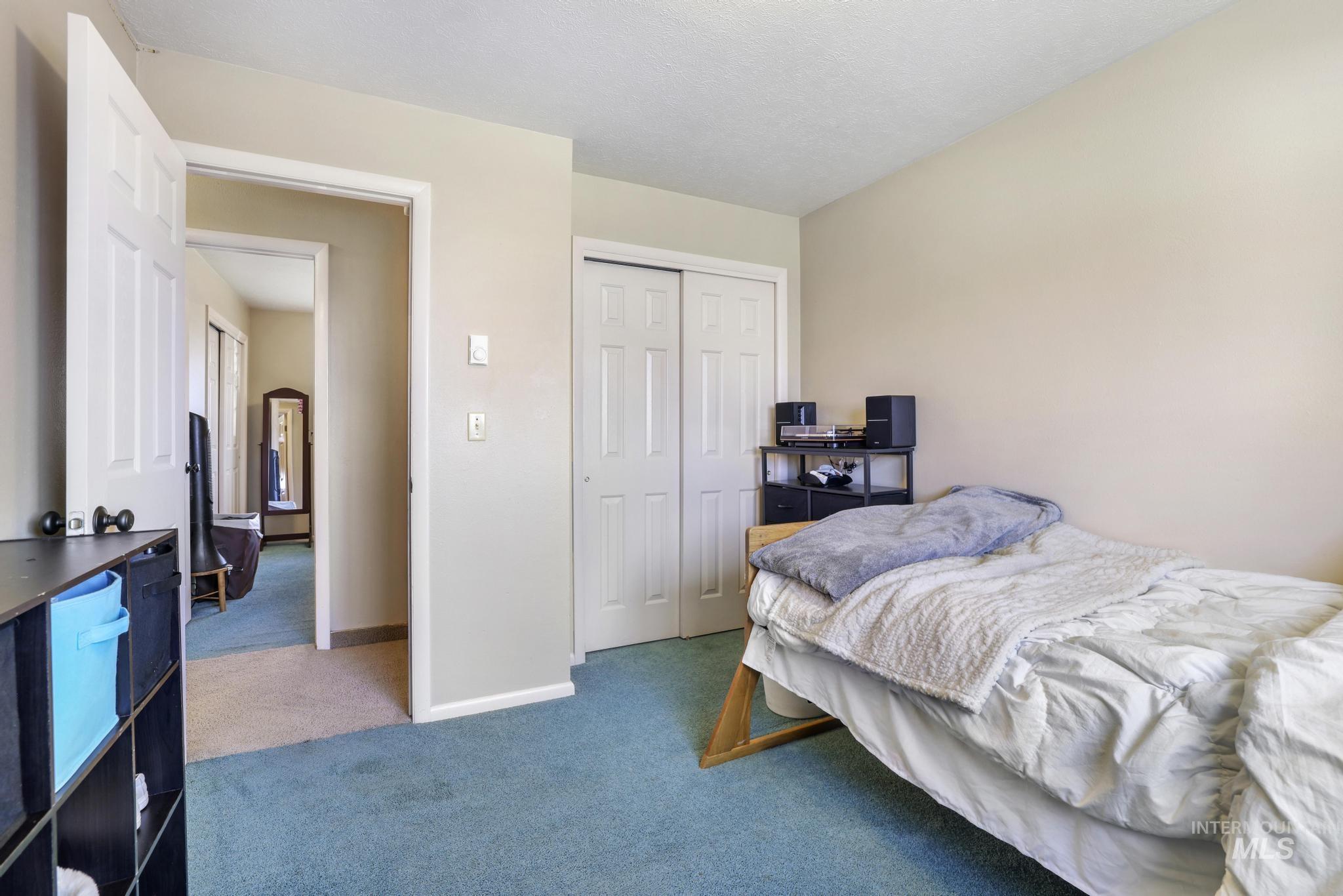 618 Sharon Street Rupert, ID 83350 - Photo 14 of 20 Bedroom featuring carpet floors and a closet