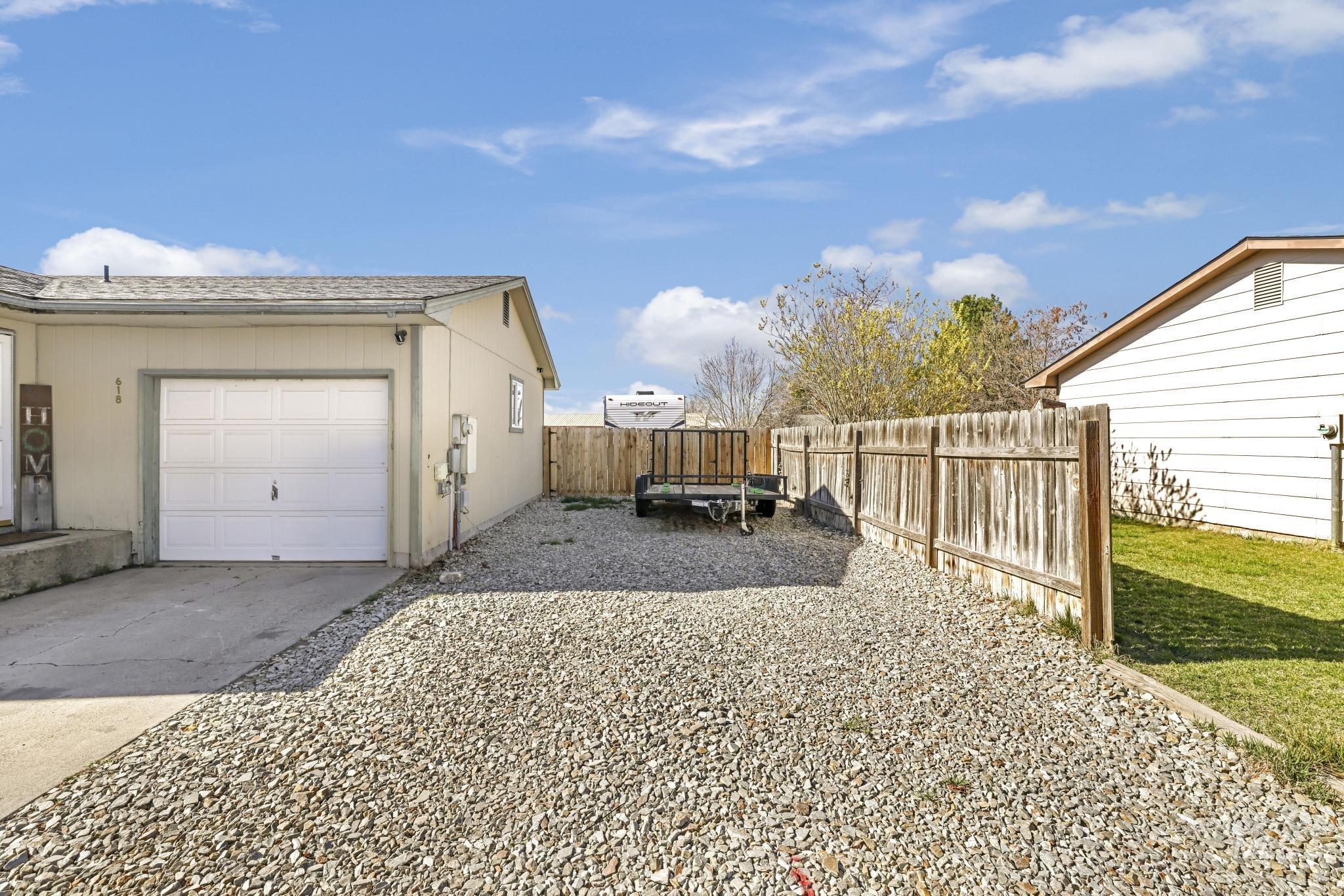 618 Sharon Street Rupert, ID 83350 - Photo 3 of 20 View of property exterior with concrete driveway, a fenced backyard, and a garage