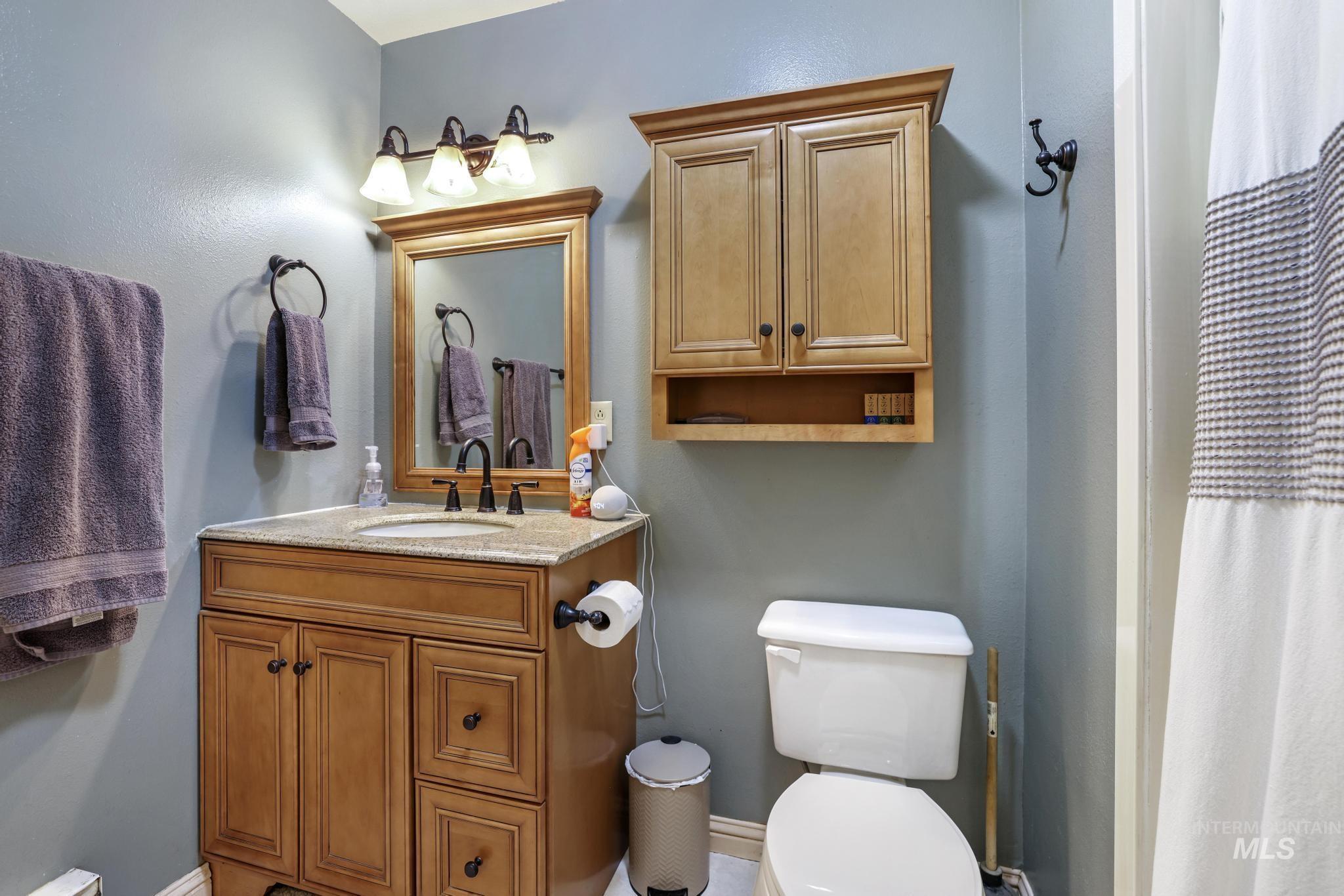 618 Sharon Street Rupert, ID 83350 - Photo 10 of 20 Bathroom with a shower with curtain and vanity