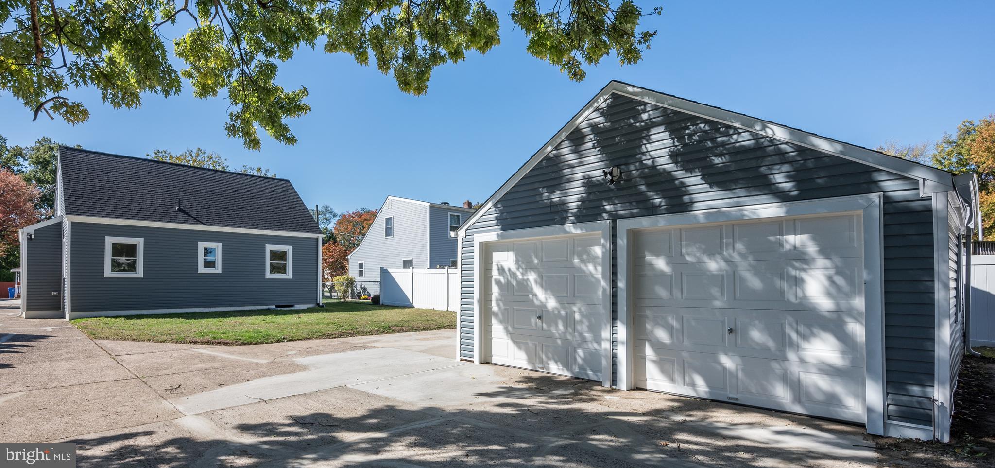 477 Buttonwood Avenue Maple Shade, NJ 08052 - Photo 11 of 32 a view of a brick house with a yard