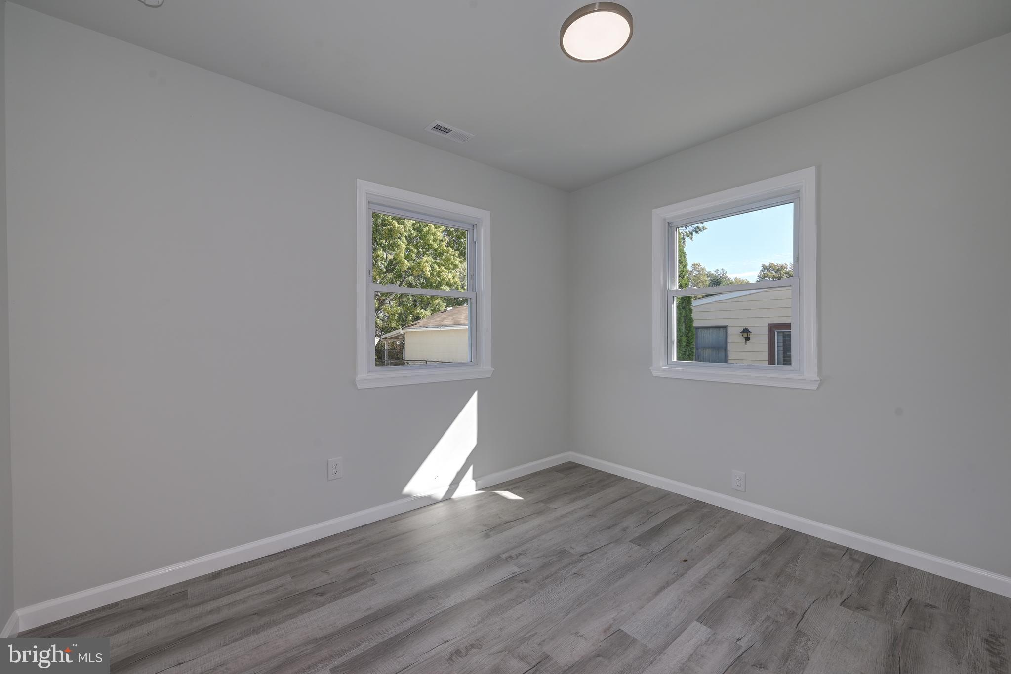 477 Buttonwood Avenue Maple Shade, NJ 08052 - Photo 23 of 32 a view of a livingroom with wooden floor and a window