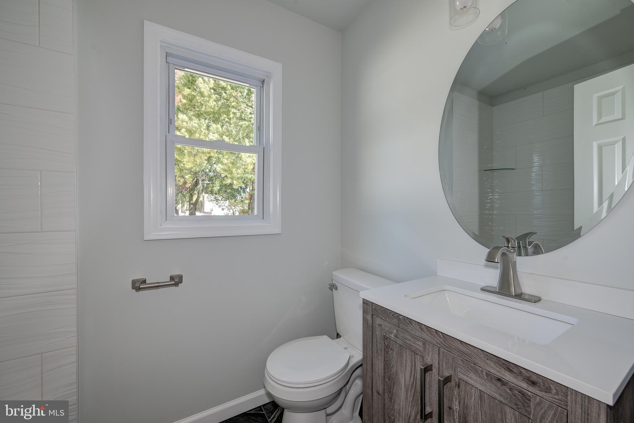 477 Buttonwood Avenue Maple Shade, NJ 08052 - Photo 24 of 32 a bathroom with a toilet a sink and mirror