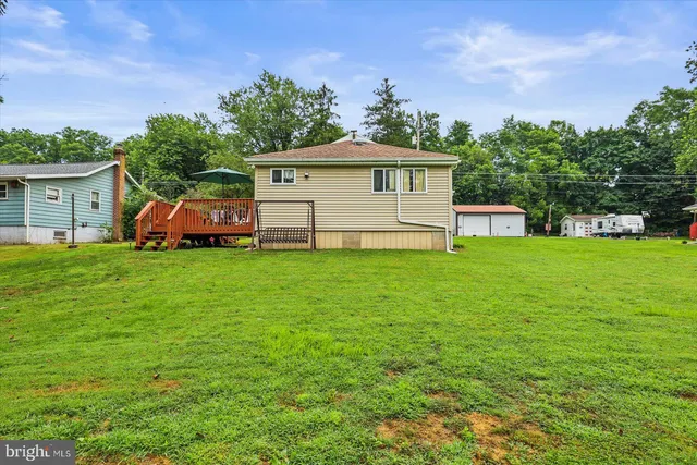 a view of a chair and table on the deck