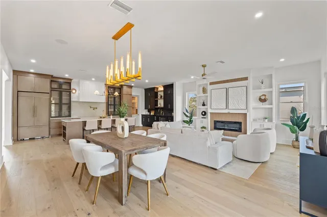 a bathroom with a toilet sink vanity and mirror