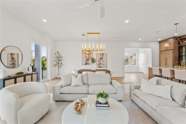 a bedroom with a bed a potted plant and a table