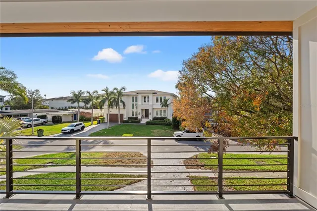 a view of a room with wooden floor and white walls