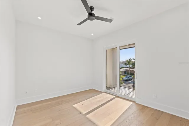 a view of hallway with wooden floor