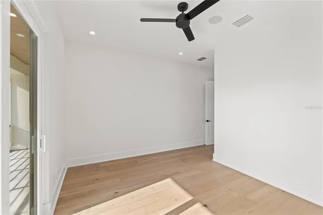 a view of a patio with a table chairs and a backyard