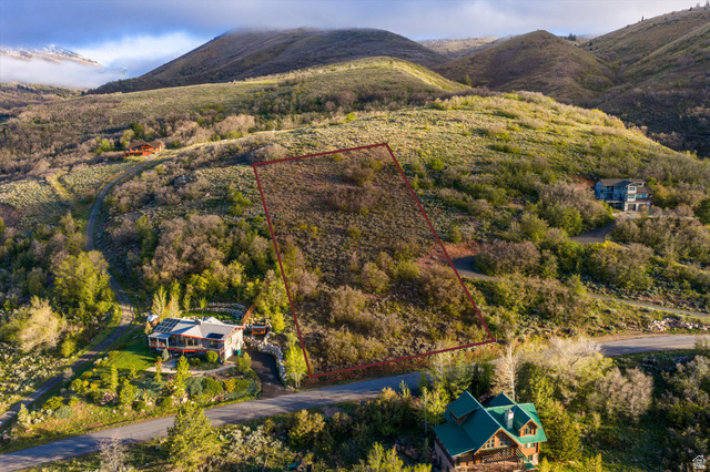 6975 North Durfee Way, Unit 20 Eden, UT 84310 - Photo 1 of 15 Expansive undeveloped lot featuring natural vegetation and sloped terrain