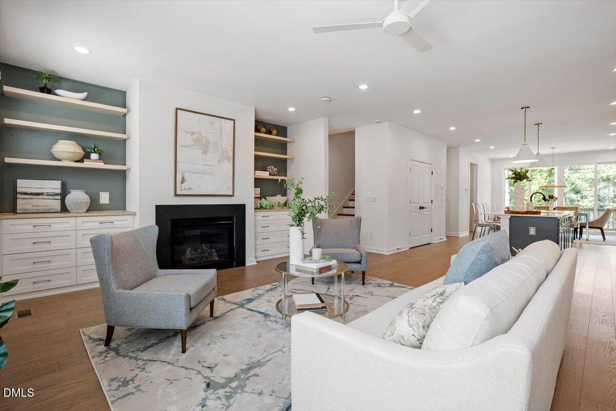 6419 Tanner Oak Lane Raleigh, NC 27613 - Photo 20 of 39 a living room with furniture and a fireplace