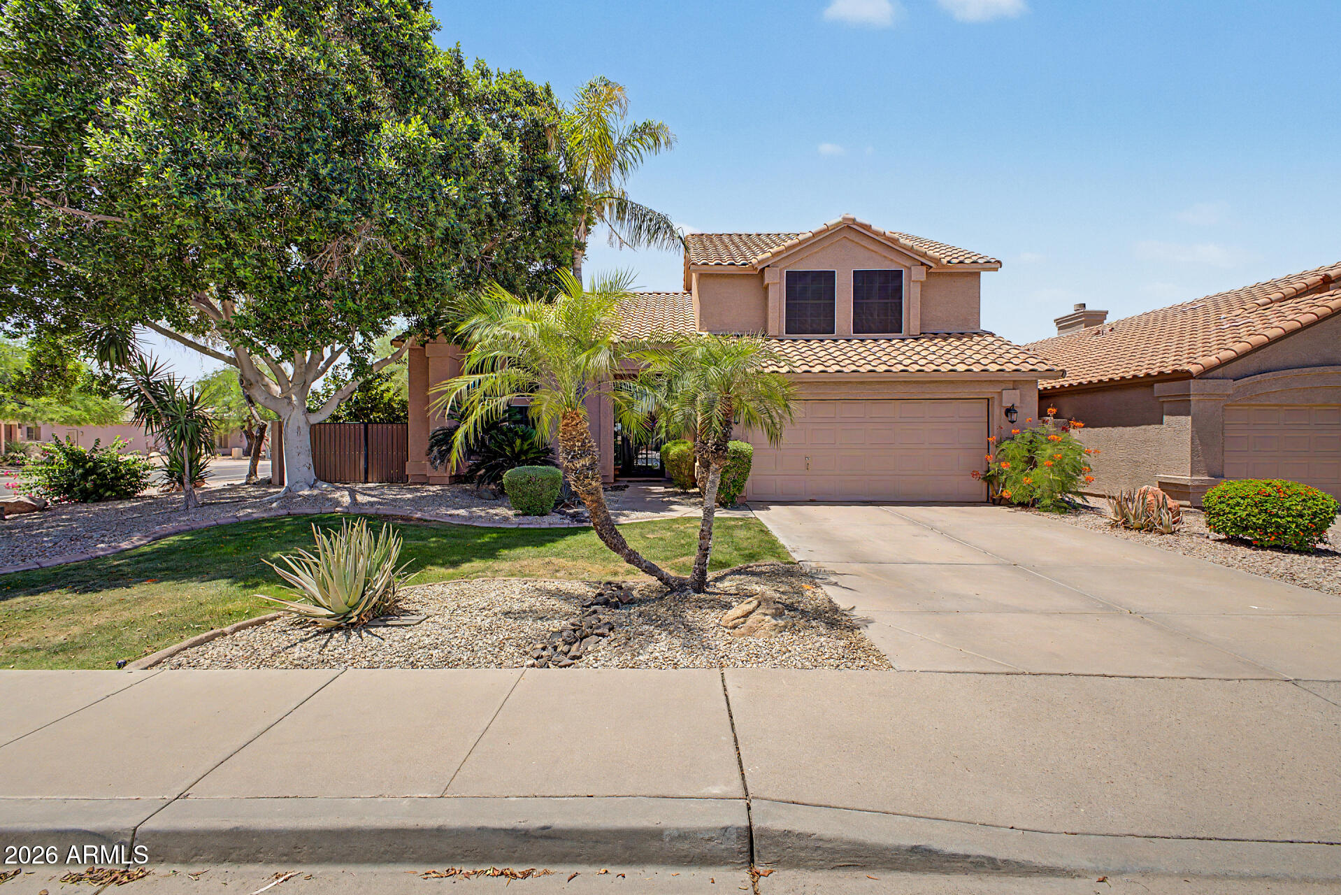 3948 North Ranier Mesa, AZ 85215 - Photo 3 of 69 a house with a yard and a fountain
