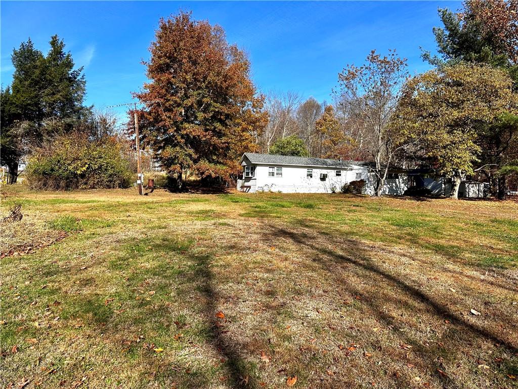 192 Pekar Road Point Marion, PA 15474 - Photo 2 of 16 a view of a field with an trees in the background