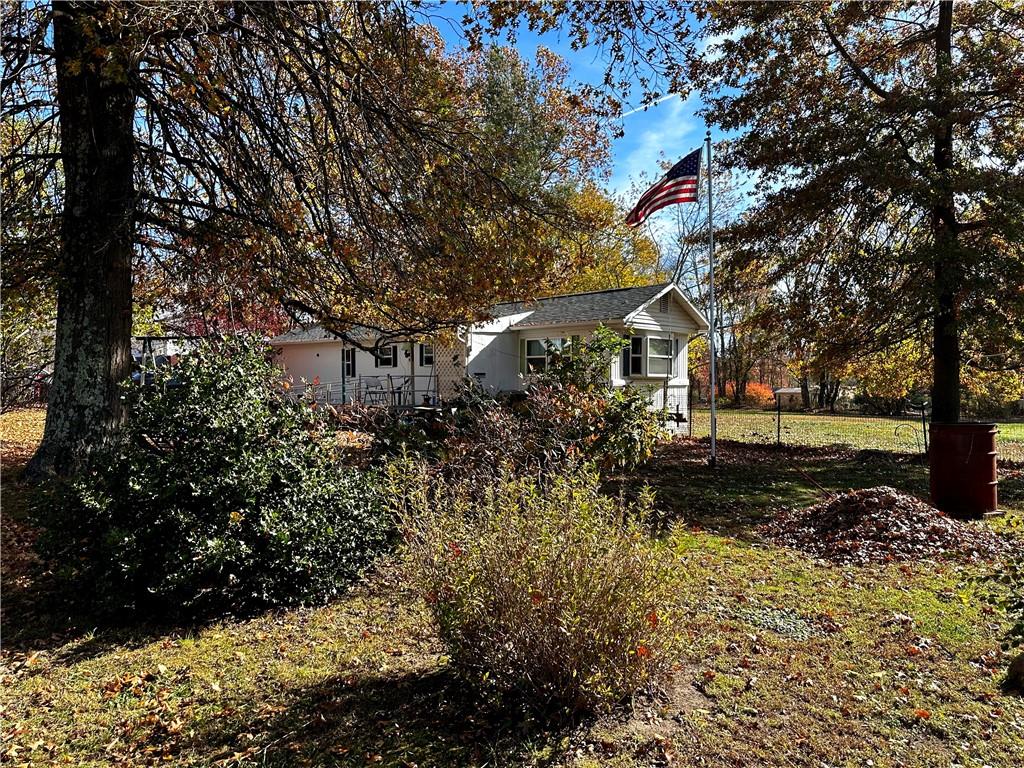 192 Pekar Road Point Marion, PA 15474 - Photo 5 of 16 a view of a yard with plants and trees