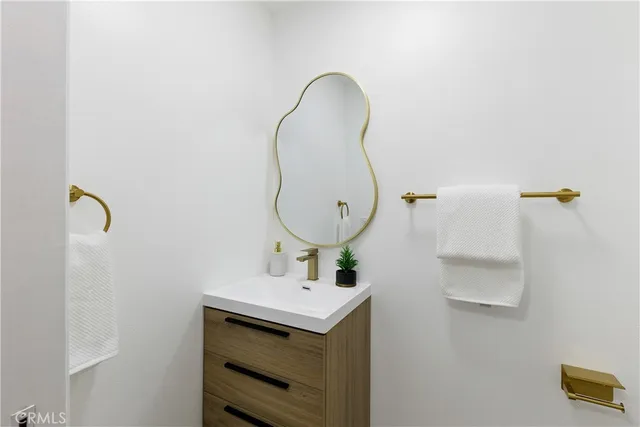 a bathroom with a sink and mirror