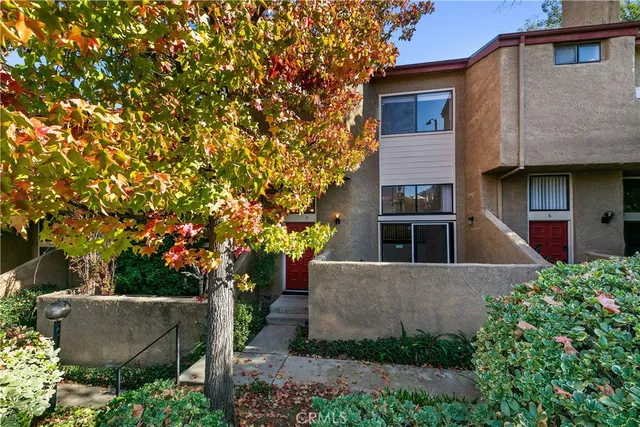 front view of house with a tree