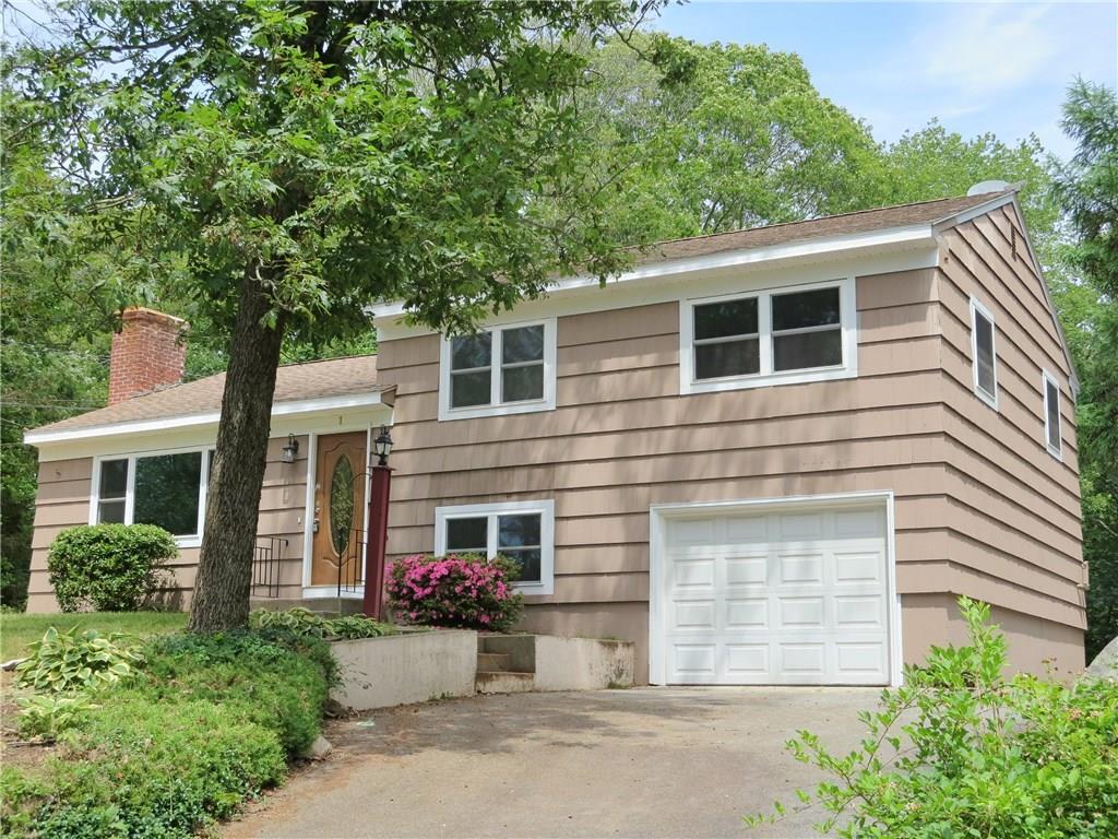 a front view of a house with yard