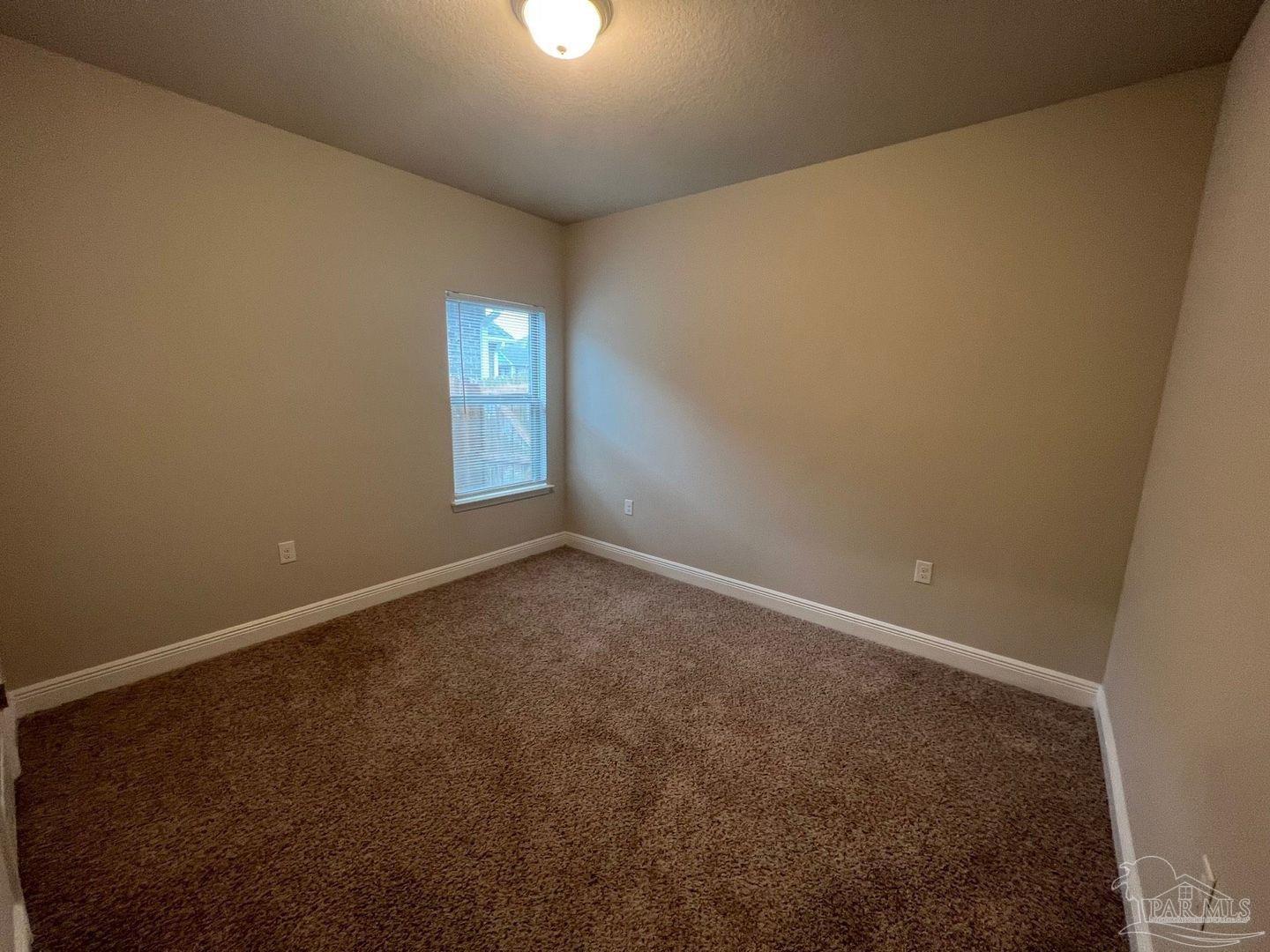 5319 Red Shoulder Road Pace, FL 32571 - Photo 14 of 26 an empty room with windows and closet