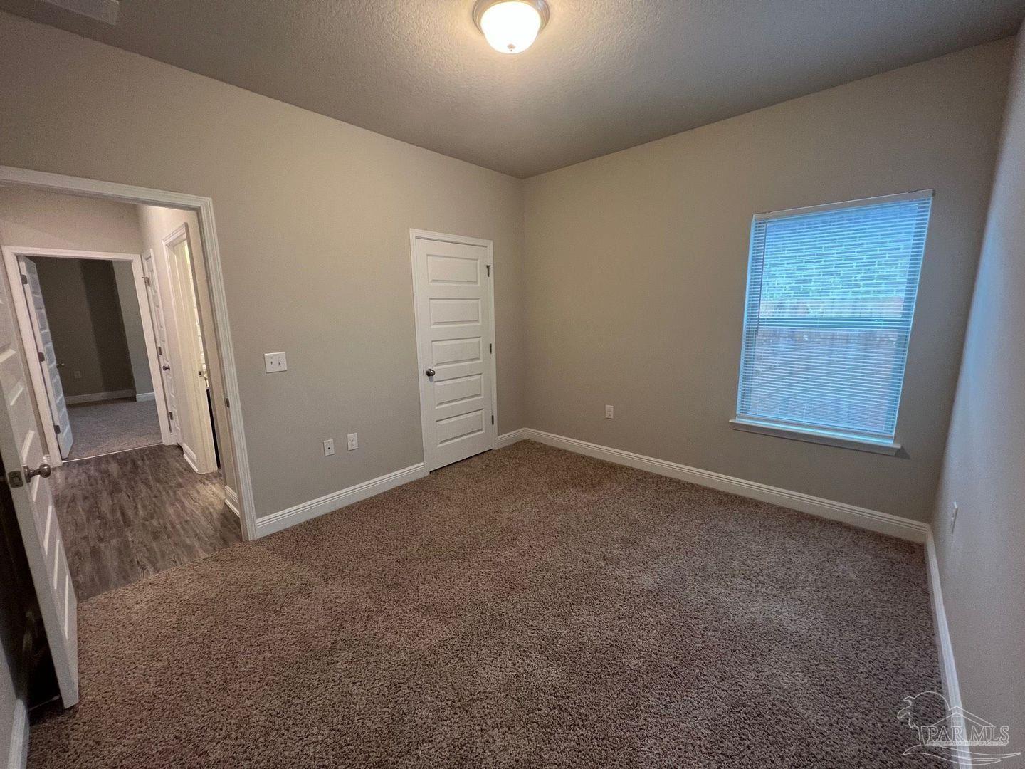 5319 Red Shoulder Road Pace, FL 32571 - Photo 15 of 26 an empty room with windows