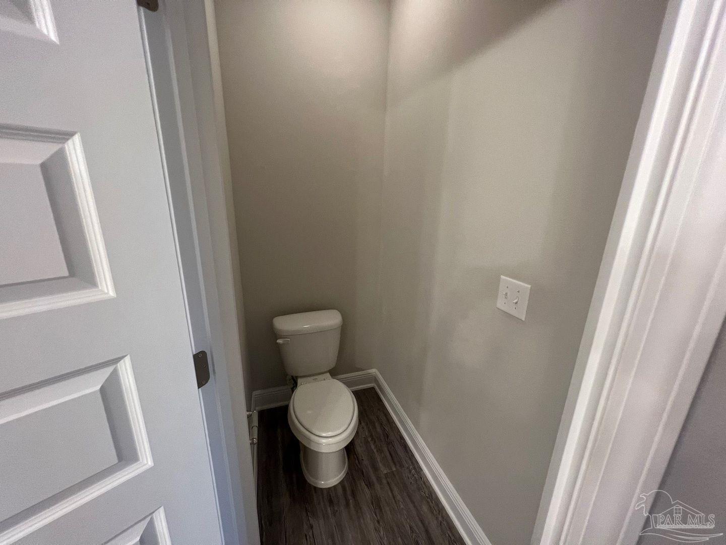 5319 Red Shoulder Road Pace, FL 32571 - Photo 21 of 26 a white toilet sitting next to a sink