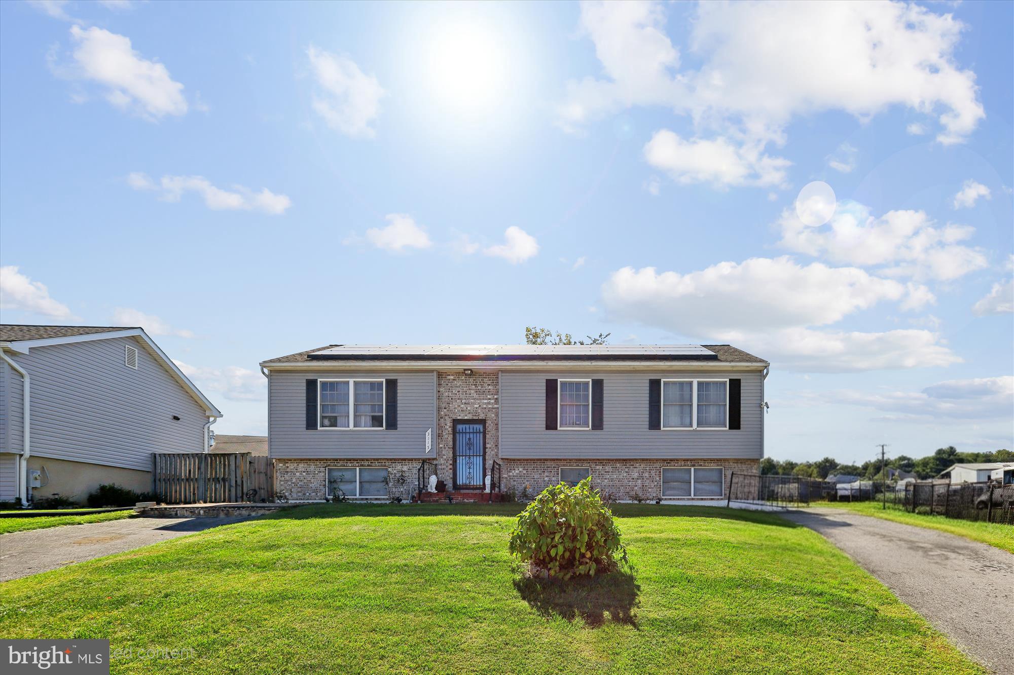 a house view with swimming pool and yard