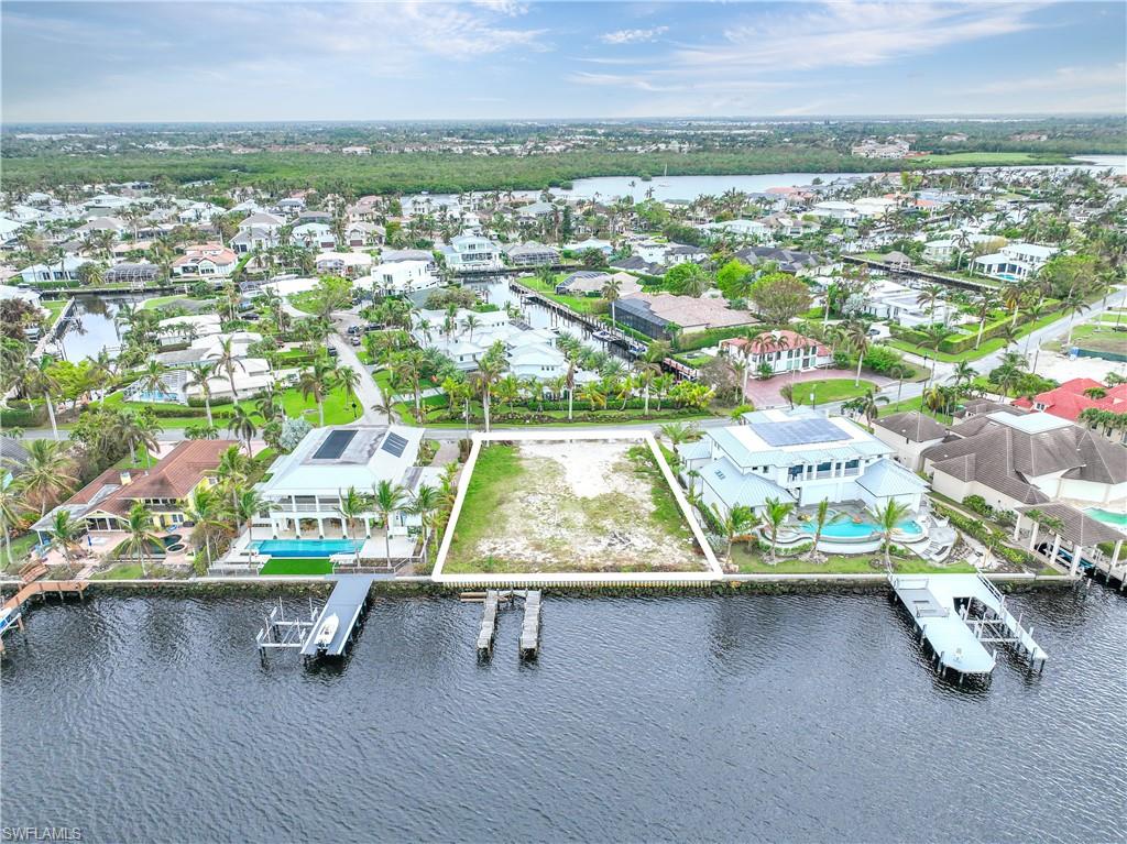 2188 Kingfish Road Naples, FL 34102 - Photo 14 of 14 an aerial view of residential houses with outdoor space and parking