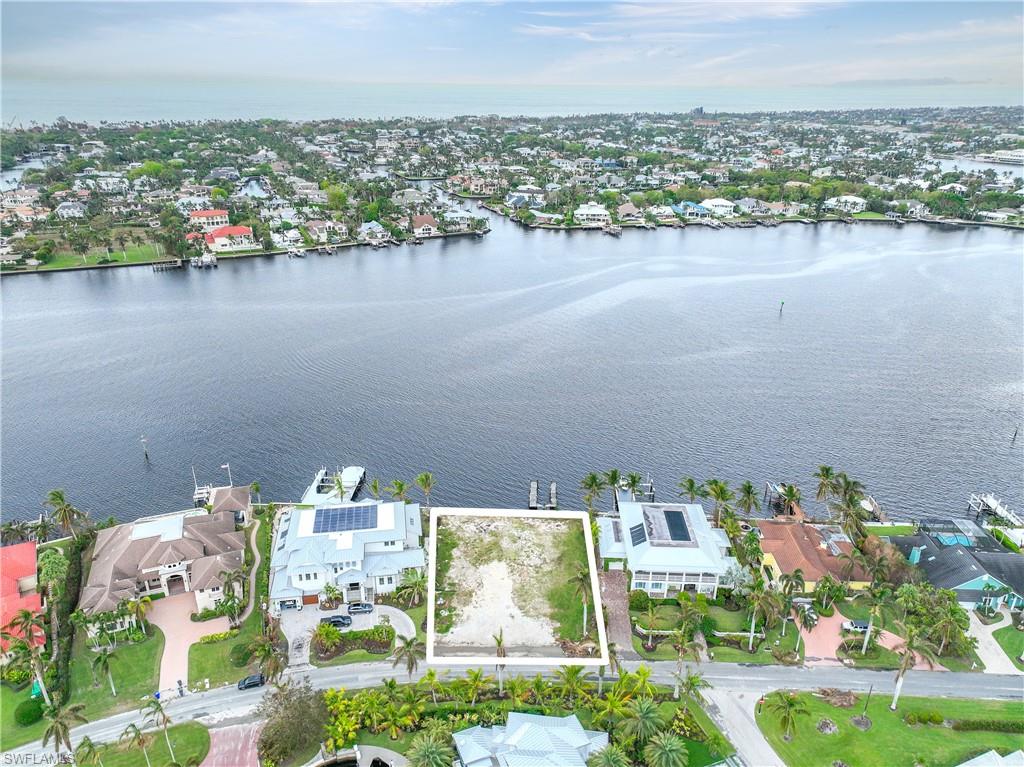 2188 Kingfish Road Naples, FL 34102 - Photo 2 of 14 an aerial view of a house with a lake view