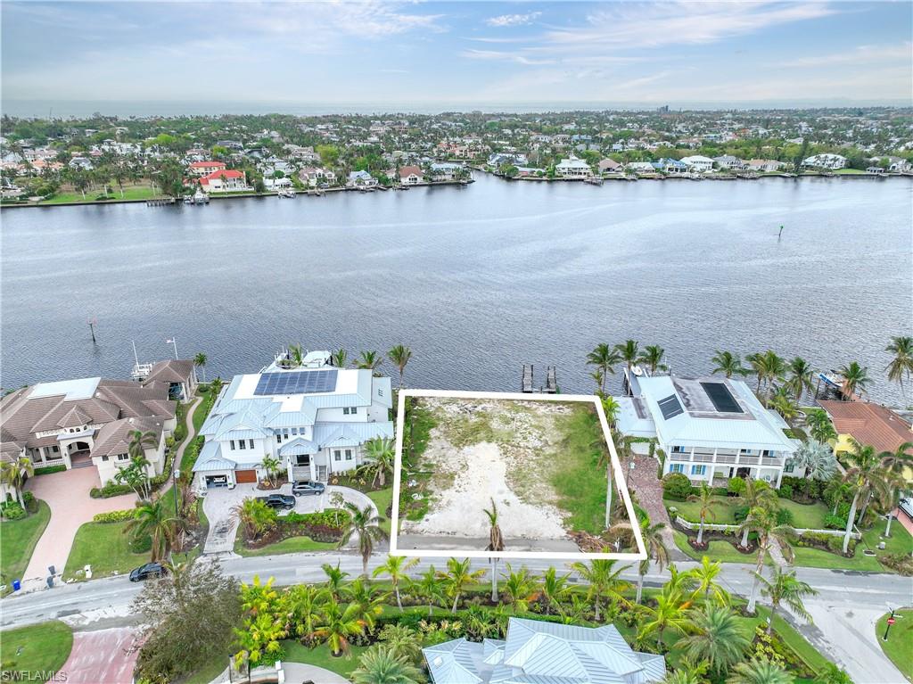 2188 Kingfish Road Naples, FL 34102 - Photo 8 of 14 an aerial view of lake and residential houses with outdoor space