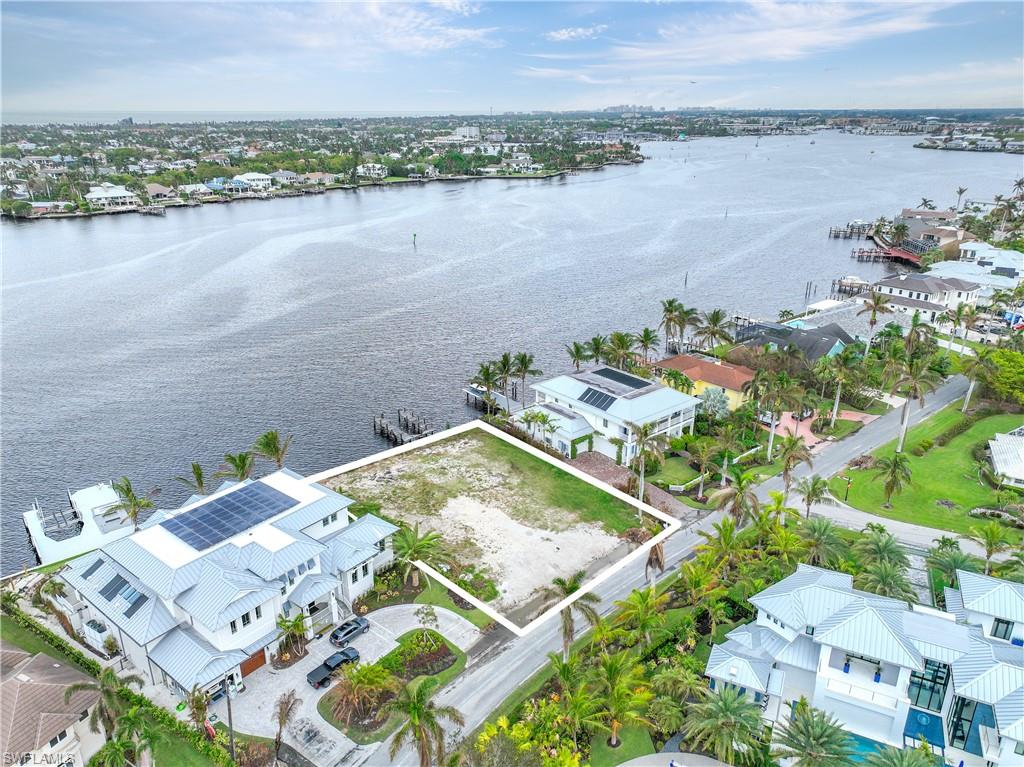 2188 Kingfish Road Naples, FL 34102 - Photo 9 of 14 an aerial view of a house with outdoor space and lake view