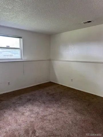 a view of a window in an empty room