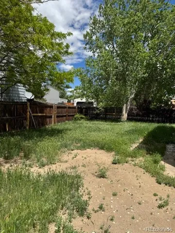 a view of a backyard with a garden