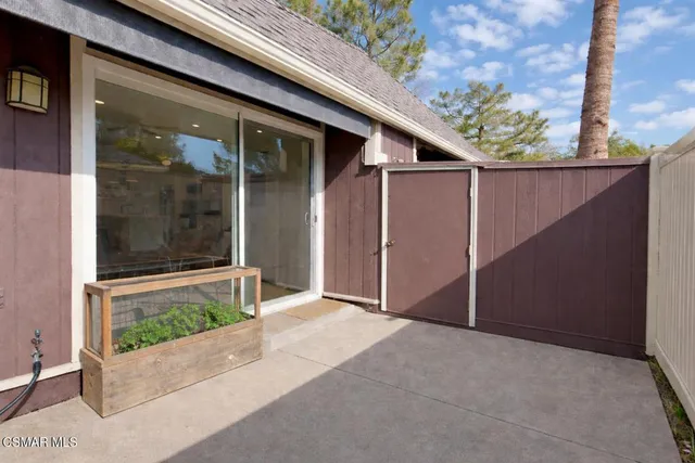 a view of a field of grass and a tree