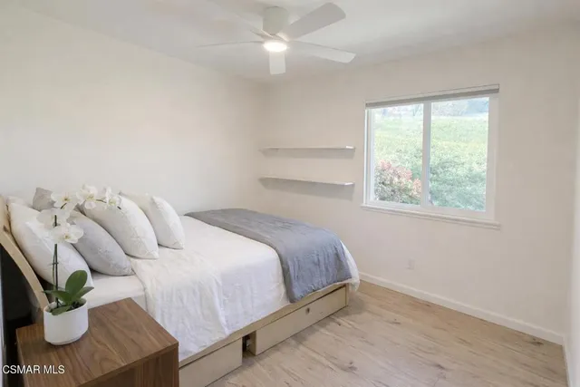 a bathroom with a granite countertop toilet and a bathtub