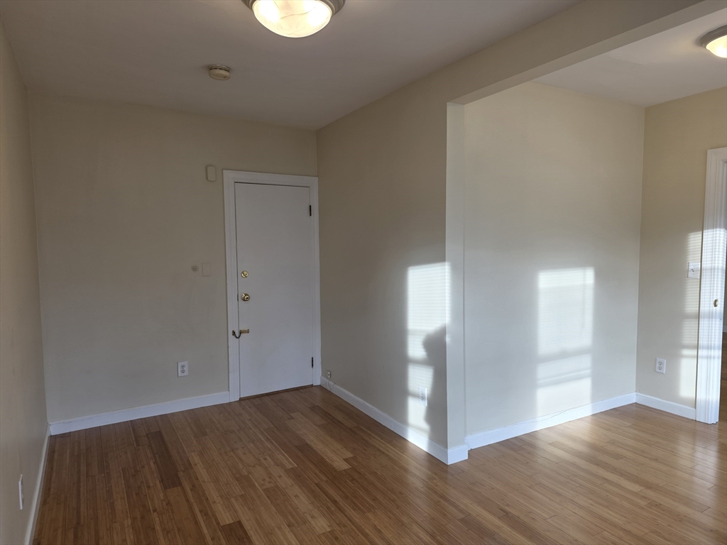 531 Cambridge Street, Unit 2 Cambridge, MA 02141 - Photo 11 of 22 a view of a room with wooden floor