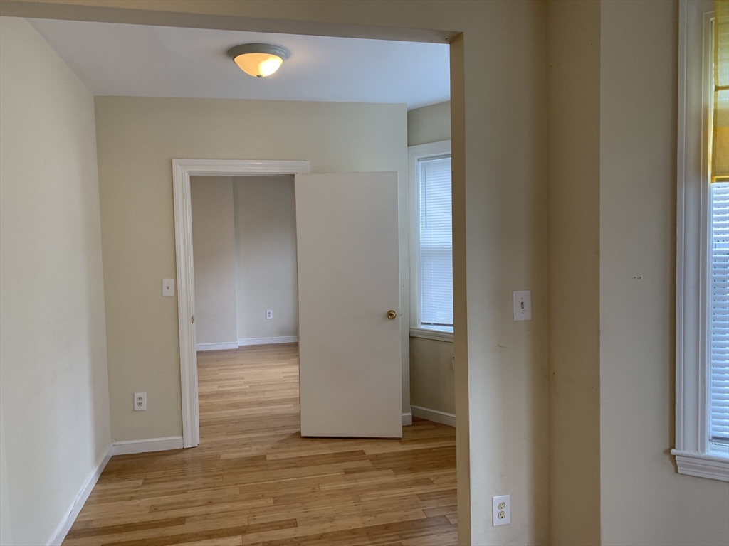 531 Cambridge Street, Unit 2 Cambridge, MA 02141 - Photo 10 of 22 a view of a room with wooden floor