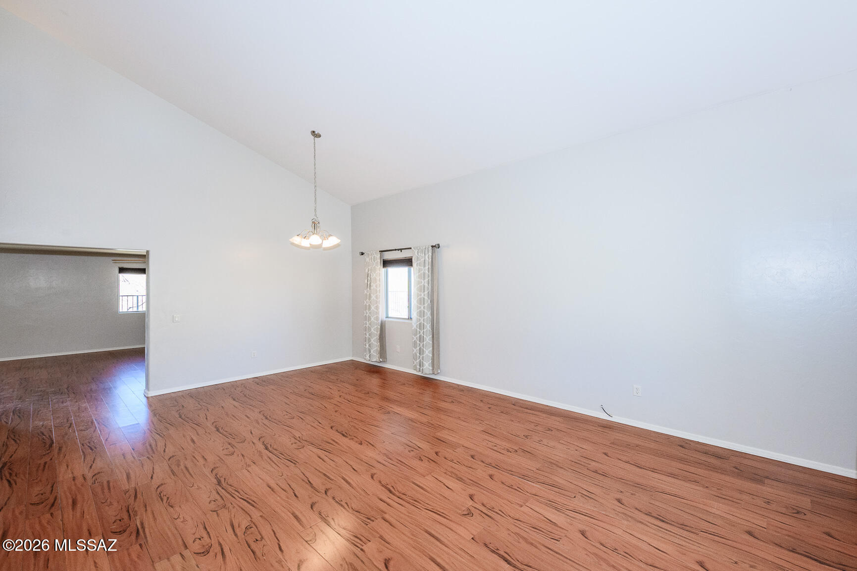 728 South Porter Routh Place Vail, AZ 85641 - Photo 6 of 36 a view of an empty room with wooden floor and window