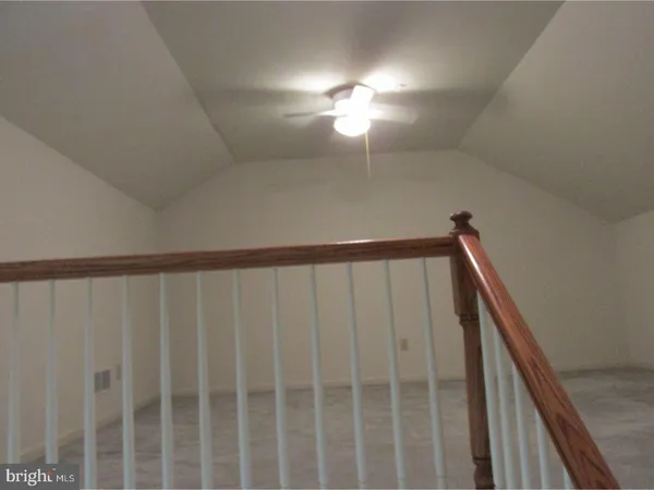 a view of staircase with rug