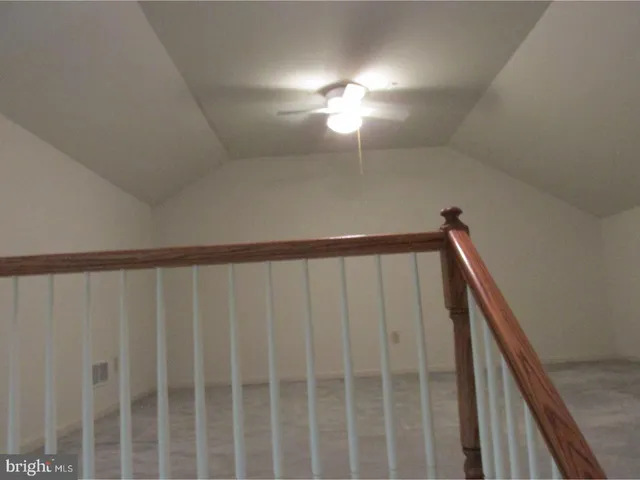 a view of staircase with rug