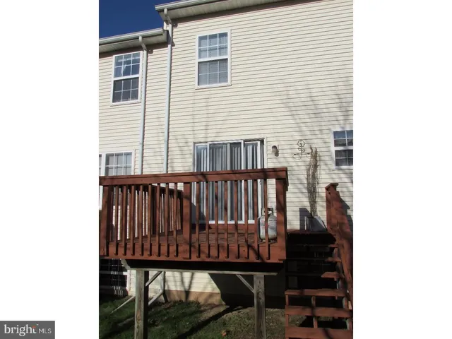 a view of a balcony with a bench