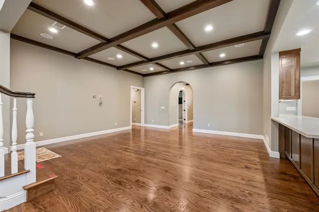 a large kitchen with stainless steel appliances granite countertop a stove and a sink