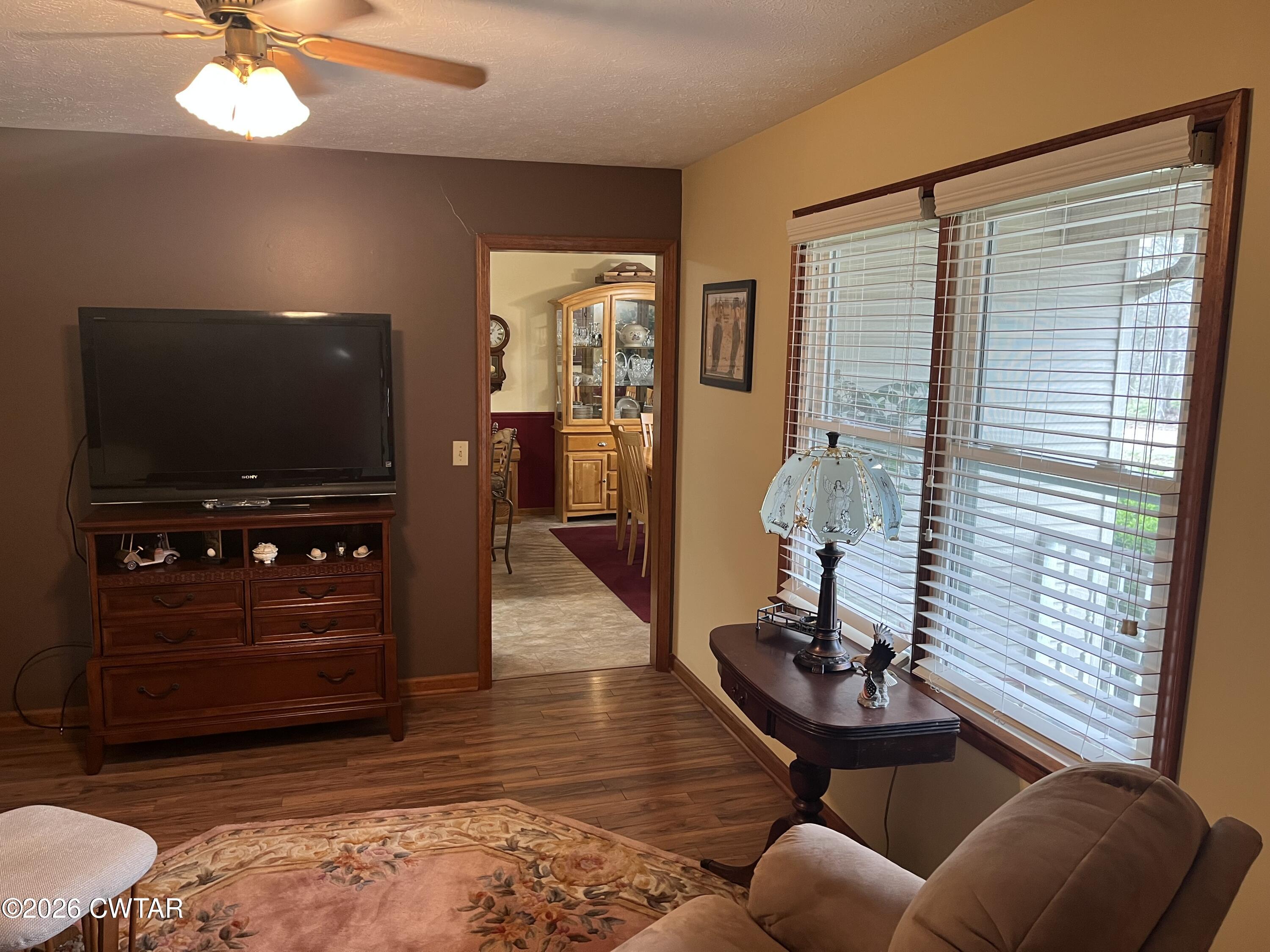 20 Homer Craig Road Humboldt, TN 38343 - Photo 18 of 28 a living room with furniture and a flat screen tv