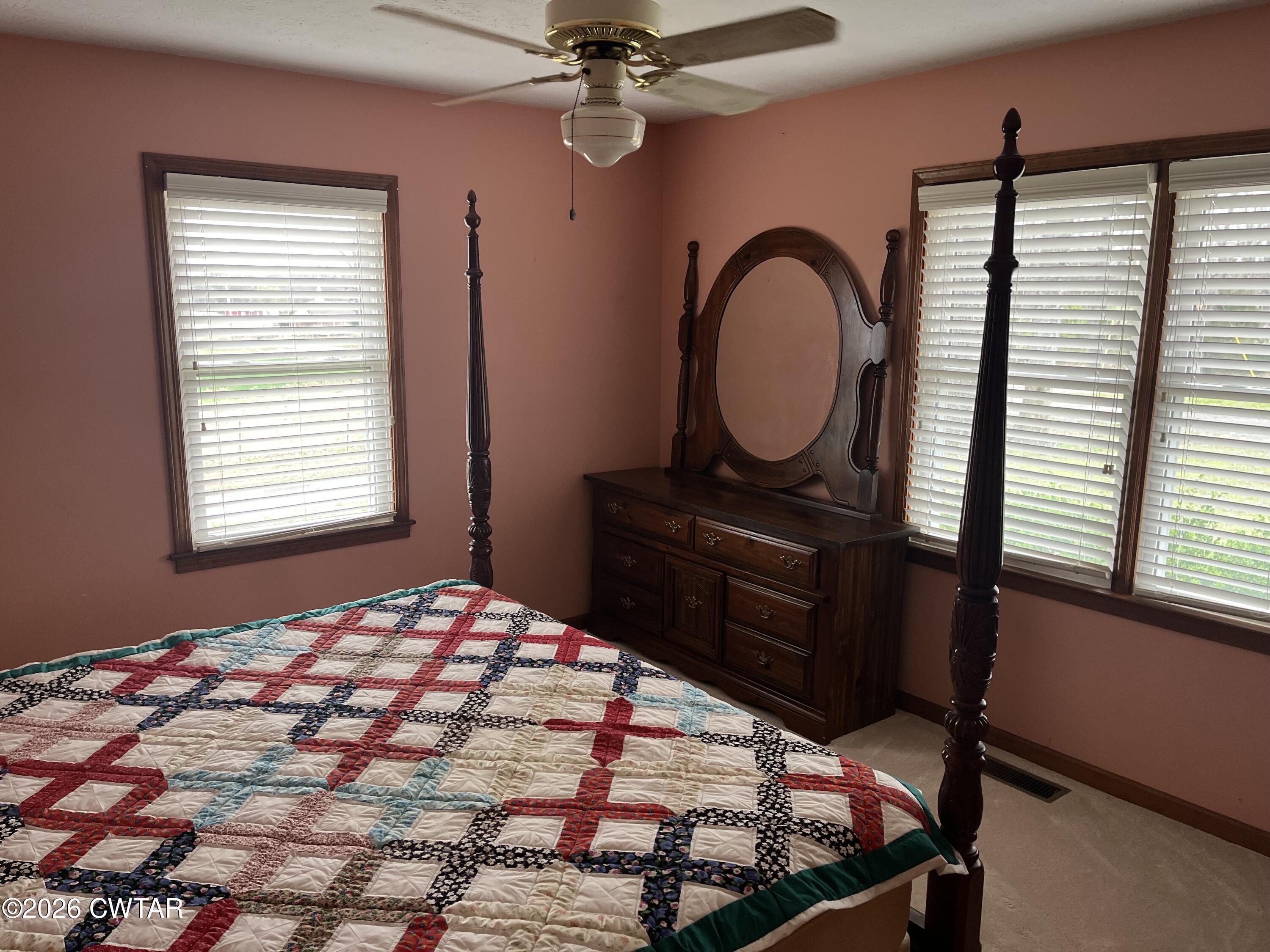 20 Homer Craig Road Humboldt, TN 38343 - Photo 20 of 28 a bedroom with a bed and a dresser next to a window