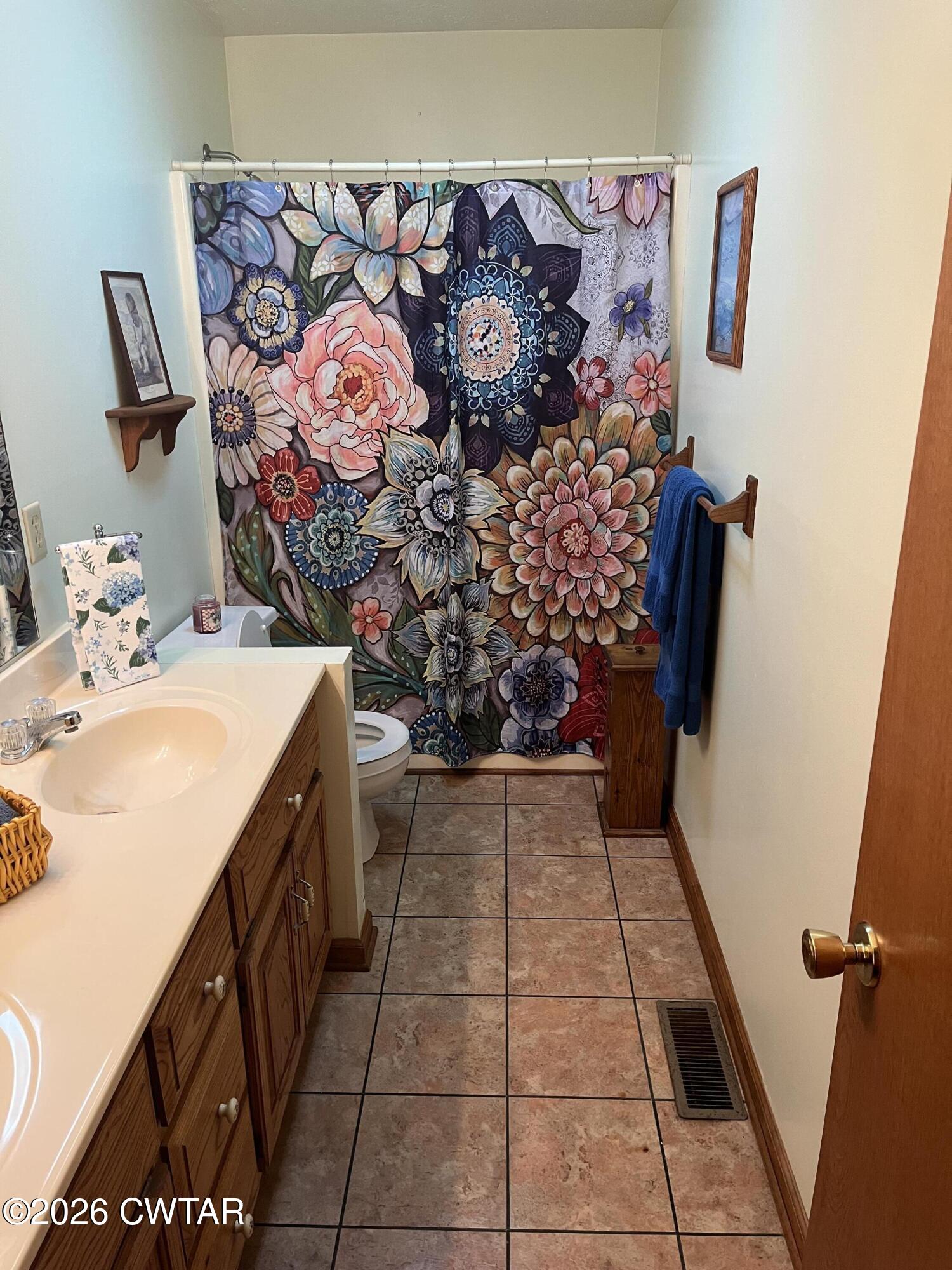 20 Homer Craig Road Humboldt, TN 38343 - Photo 24 of 28 a bathroom with a sink toilet and vanity
